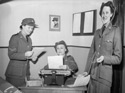 Female military personnel working in an office