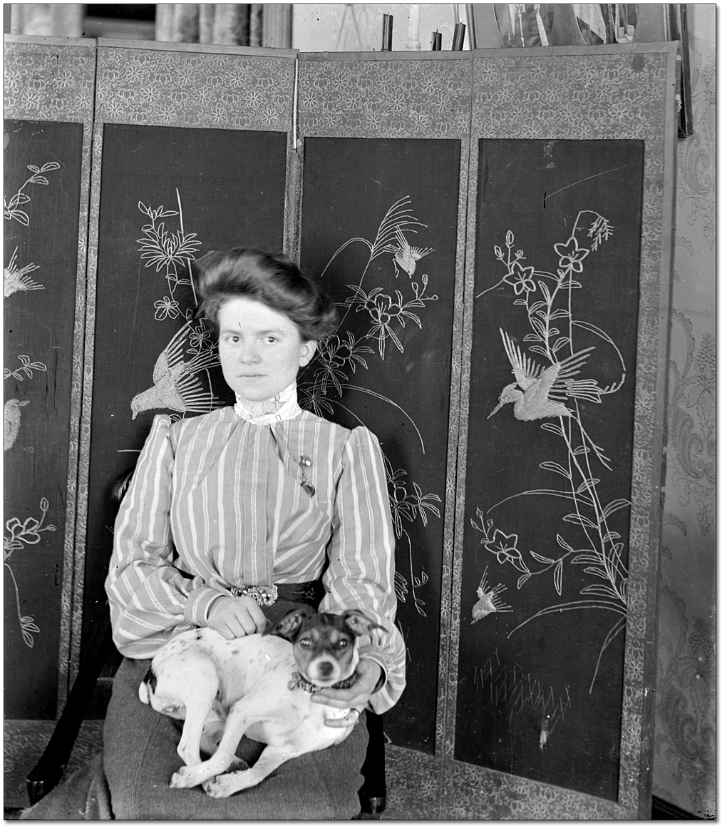 Portrait of an unidentified woman and her dog, [between 1898 and 1920]