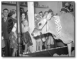 Photo: Children with Elsie the cow at the Canadian National Exhibition, [ca. 1941]