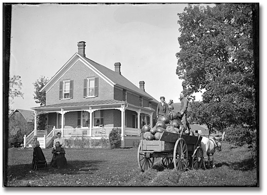 Photo: Farmhouse and load of pumpkins, September 1905