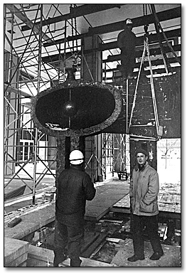 Photo: Louis Archambault oversees the installation of his sculpture, Man and Woman outside the entrance to the Hepburn Block, 1968 (detail)