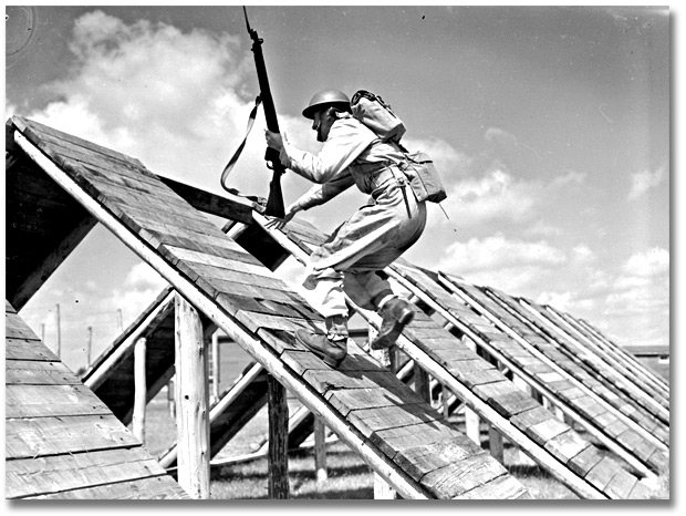 Photo: Soldier running a ramp during training exercise, [ca. 1945]