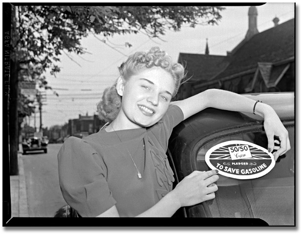 Photo: Woman with 50/50 Car – gasoline pledge, 1941