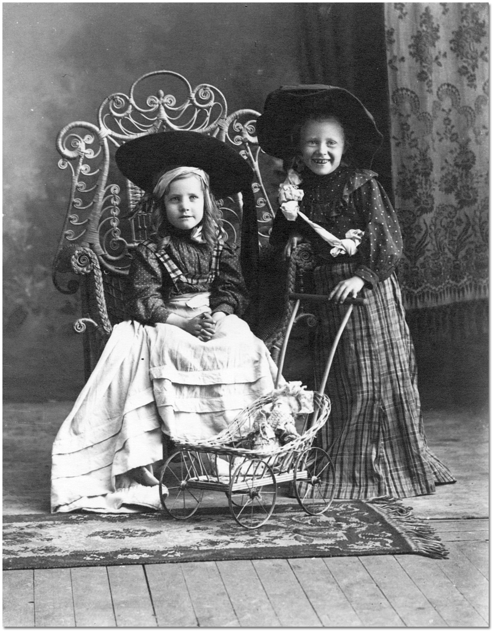 Photo: Two girls with doll carriage, [190-?]