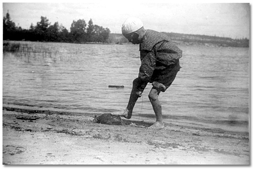 Photo: Playful scene of a boy training a turtle, [between 1875 and 1900]