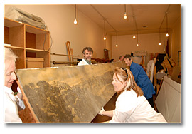 Photo: Conservators Lifting Panorama