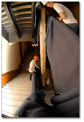 Photo: Guiding the Lowering of a Panorama in the Stairwell