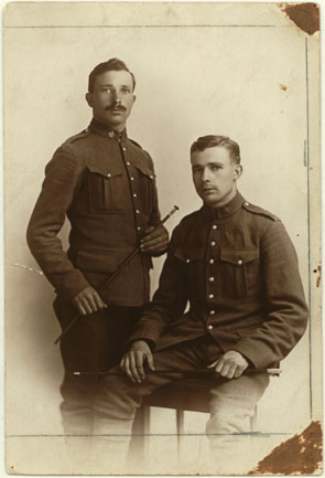 Studio Photograph of Charles and Walter Gray  posing in their uniforms prior to shipping overseas to fight in World War I