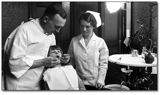Photo: Young girl having her teeth checked at the Dental Clinic, Hamilton, [ca. 1930]