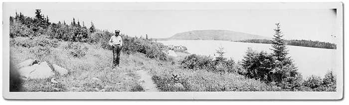 Photo: Young Aboriginal man on a hillside, [ca. 1915]