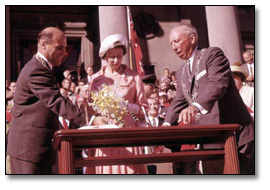 Photo: Queen Elizabeth signing a guestbook with the mayors of Kitchener and Waterloo, 1969 (detail)