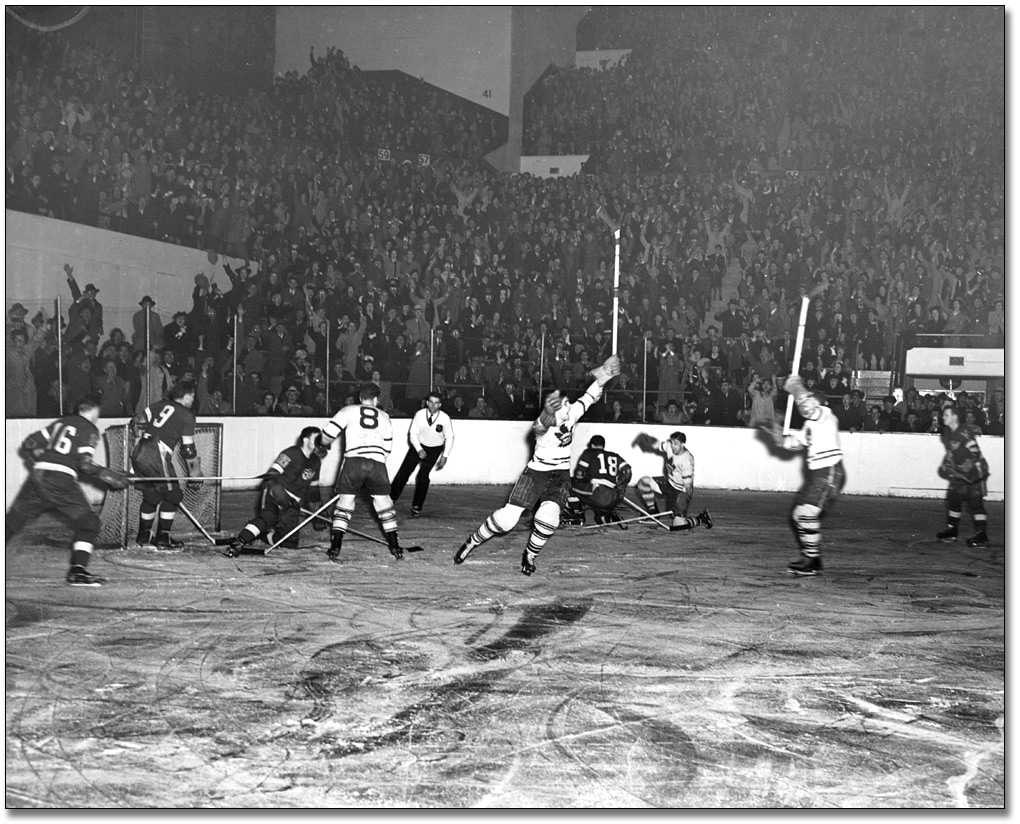 Photo: Toronto Maple Leafs player scoring goal against Detroit Red Wings, Stanley Cup Playoffs, 1942