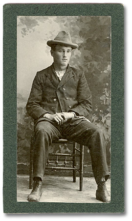 William Rae (alias Frank Hall) is one of five suspects in the collection photographed wearing handcuffs, 1900 (2000.28.390)