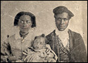 Tintype photographic portrait of black couple with their young baby