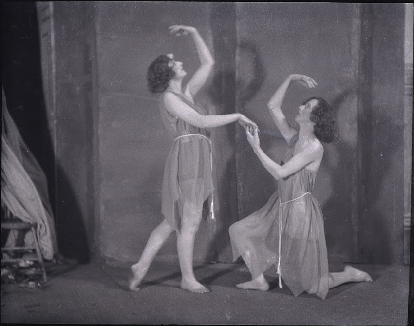 Two white female dancers, posed on stage at Shea’s Hippodrome in Toronto.