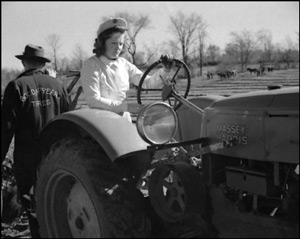 Driving a Massey-Harris tractor, International Plowing Match