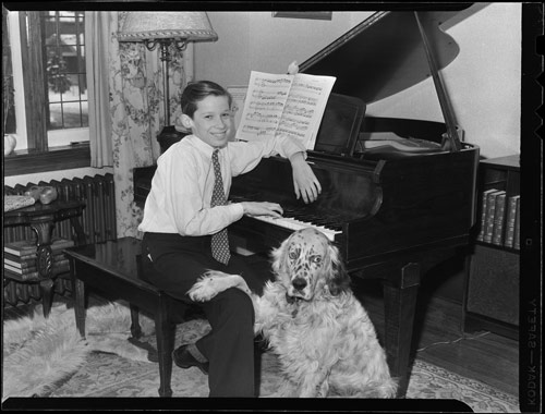 Glenn Gould as a child, at his piano with his dog Nicky, Toronto