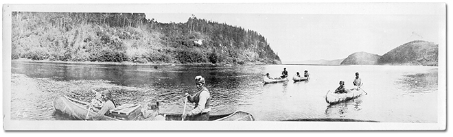 Photograph of men in canoes in Northern Ontario