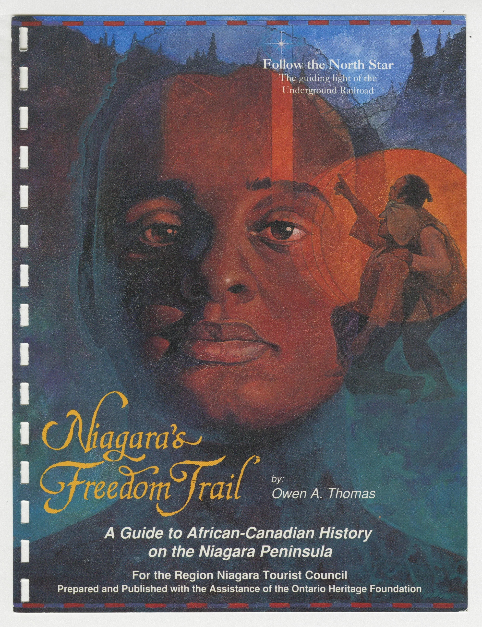 Colour photo of a pamphlet cover bearing the image of a Black person’s face and an inset image of two Black figures, one of them kneeling and pointing to something unseen in the distance. The title on the cover reads “Niagara’s Freedom Trail, by Owen A. Thomas. A Guide to African-Canadian History on the Niagara Peninsula.”