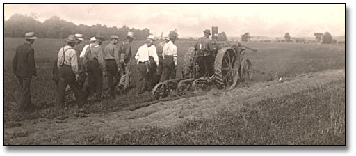 Photo: Ploughing match contestant with judges, 1916