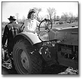 Photo: Driving a Massey-Harris tractor, International Ploughing Match, 1941