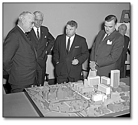 Photo: Leslie Frost, J. D. Millar (Deputy Minister of Public Works), Hon. Ray Connell (Minister of Public Works) and Premier Robarts viewing the model for the new construction at Queen's Park, April 12, 1962