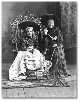 Photo: Two girls with doll carriage, [190-?]