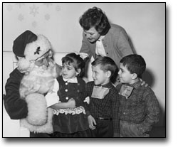 Photo: Children talking to Santa, [1957]
