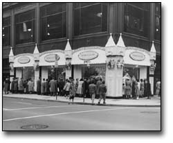 Photo: People looking at a Christmas window display, 1958