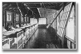 Photo: Interior view of Kendall Pavilion of the Muskoka Cottage Sanatorium, showing arrangement of glass front