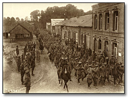 Photo: German prisoners taken by Canadians on the Somme being escorted to the prisoner's cages by Canadian Military Police