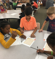 students examining record