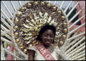 Colourful photograph of a woman derssed in an elaborate costume for the Caribana festival in Toronto