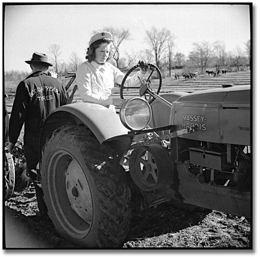 Photo: Driving a Massey-Harris tractor, International Ploughing Match, 1941