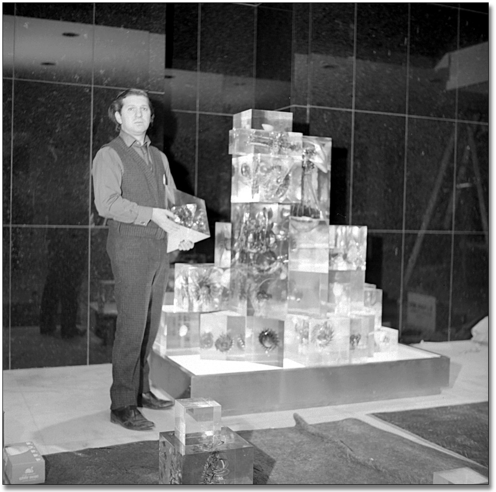 Photo: Gerald Gladstone installing his sculpture, Galaxy Series #2 '67, in the Lobby of the Macdonald Block, 1968
