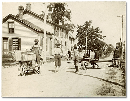 Photo: Boys with wheelbarrows in the streets of Amherstburg, Ontario [ca. 1895]