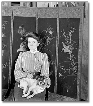 Portrait of an unidentified woman and her dog, [between 1898 and 1920]