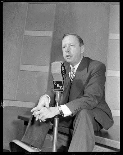 Foster Hewitt speaking into a CBC microphone, October 19, 1948