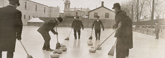 Men curling, 1909 banner