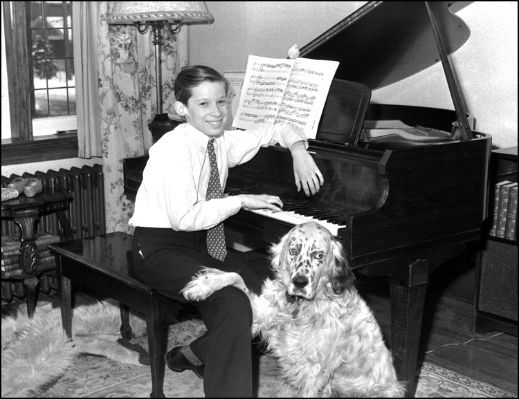 Glenn Gould as a child, at his piano with his dog Nicky, Toronto, [ca. 1940] 