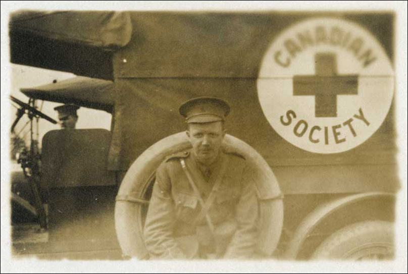 L Bruce Robertson beside Canadian Red Cross truck, ca. 1914-1918